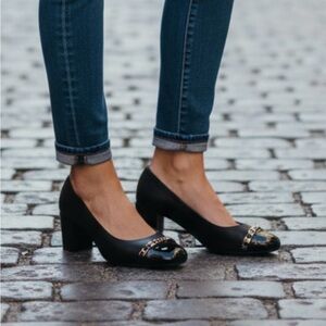 Salvatore Ferragamo black leather pumps with patent cap toe, gold Monogram chain